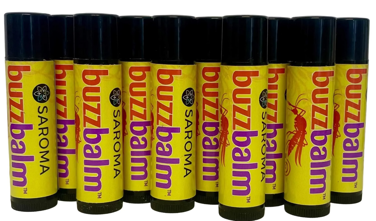 Multiple tubes of Buzzbalm lip balm by Saroma on a white background