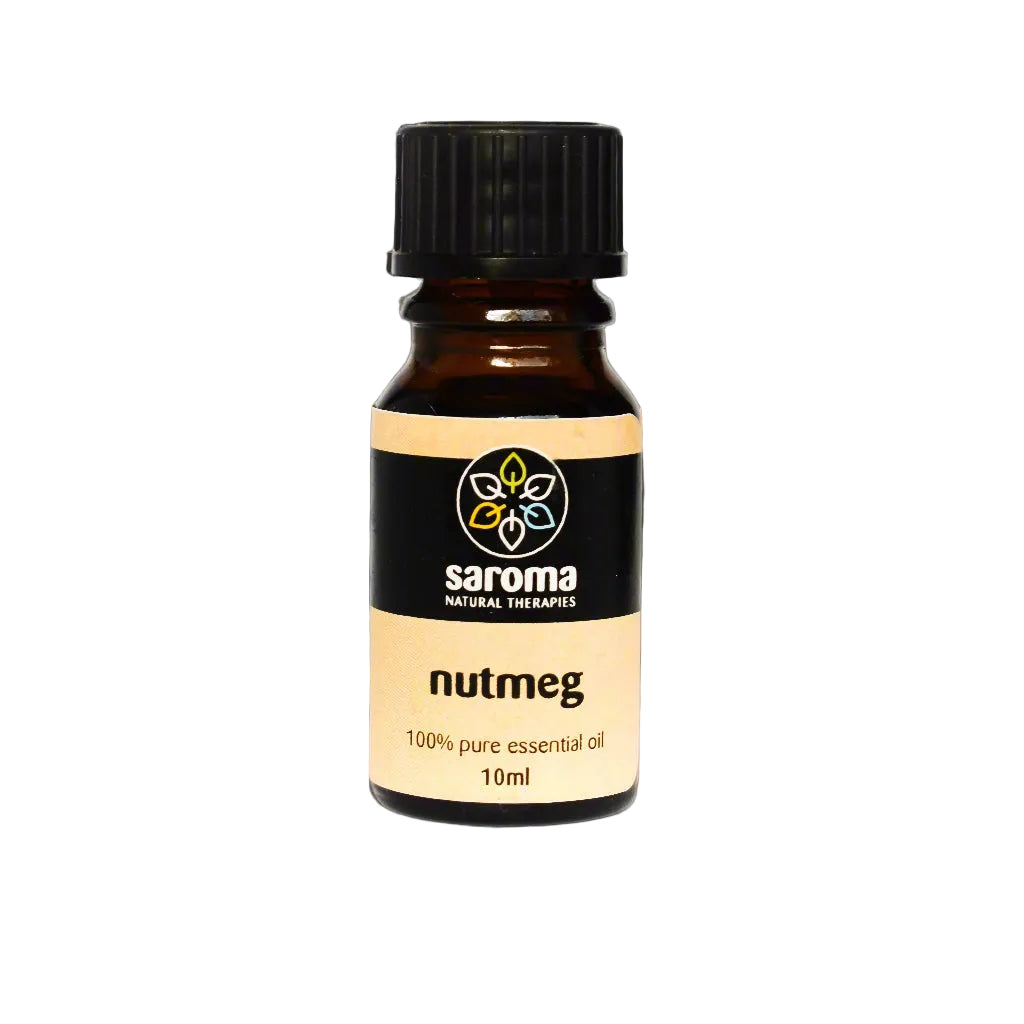 Bottle of Saroma Nutmeg Essential Oil surrounded by whole nutmeg seeds on a gray surface